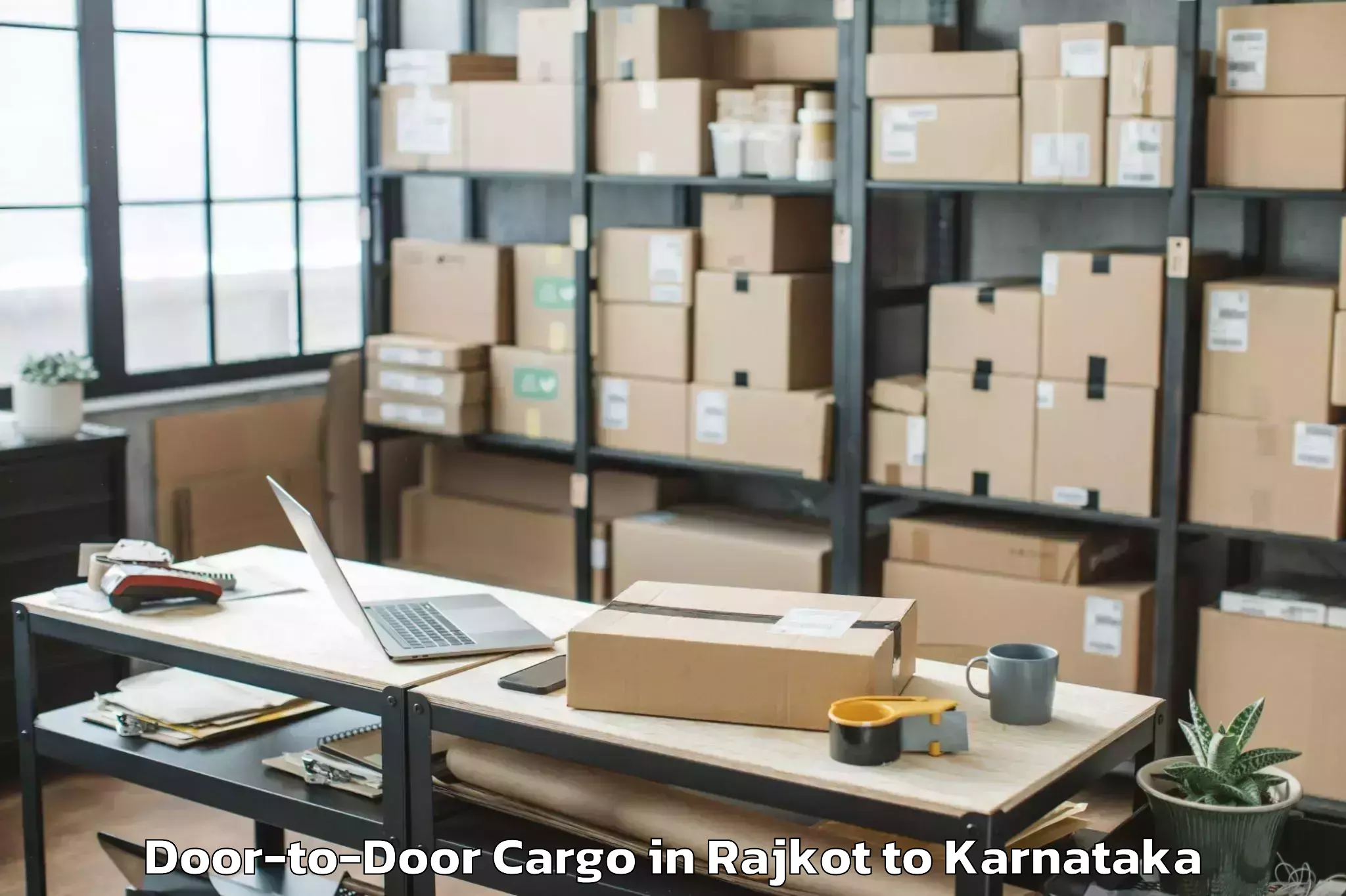 Trusted Rajkot to Karnataka State Rural Developm Door To Door Cargo